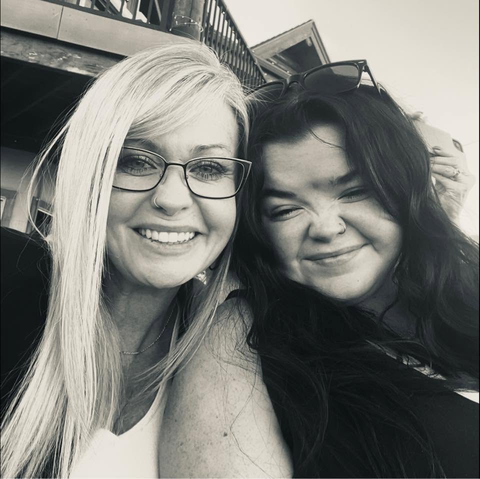 Owner Candi Stout, left, smiling in a selfie